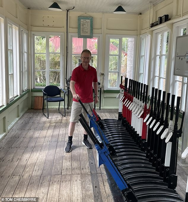 Tom is pictured here in the old-fashioned signal box of Kuranda station