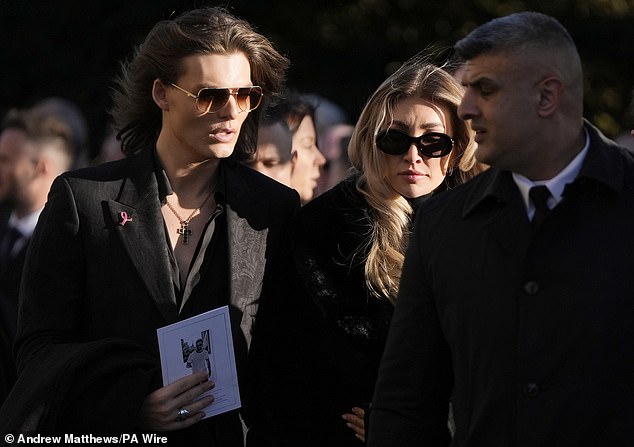 Payne's friend Kate Cassidy was comforted by her boyfriend Damian Hurley during today's service