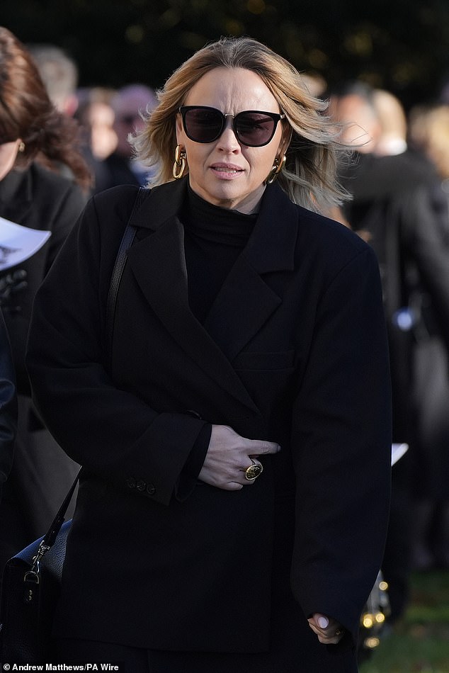 Kimberley Walsh, a former member of Girls Aloud, leaves via the cemetery today