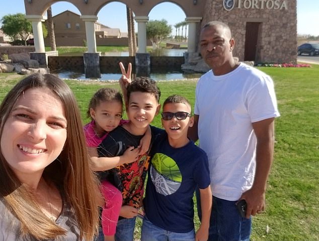 Mrs. Pratt is pictured above with her family. She said she spent three days in the hospital after battling the disease for two weeks