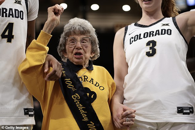 Colorado Buffaloes superfan Miss Peggy Coppom celebrates her 100th birthday Tuesday with the Colorado Buffaloes women's basketball team