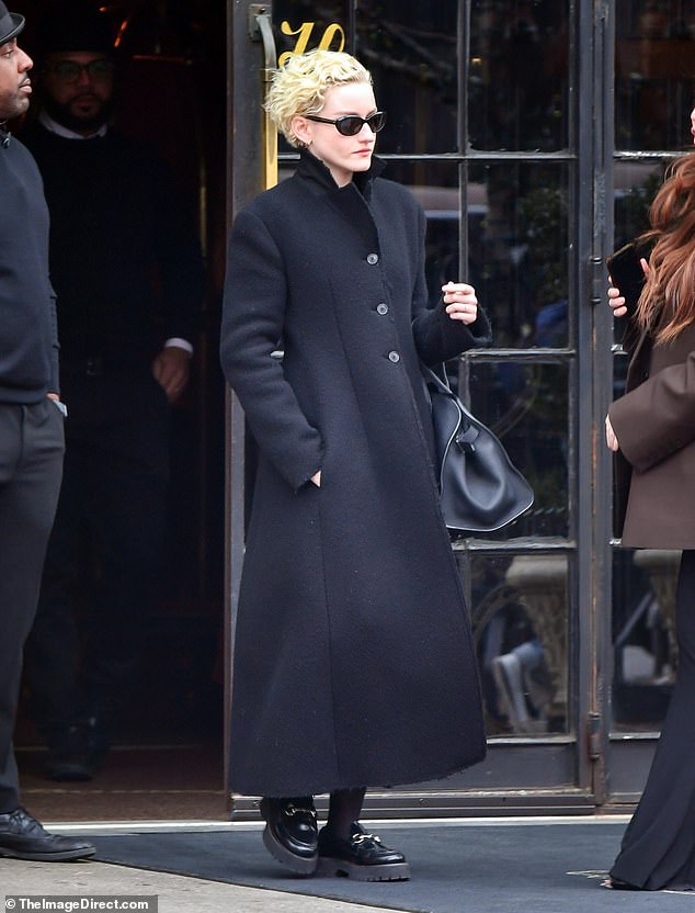 The 30-year-old Gucci brand ambassador looked chic in all-black attire: sunglasses, maxi winter coat, handbag and $1,220 Gucci 'Women's Loafer with Horsebit'