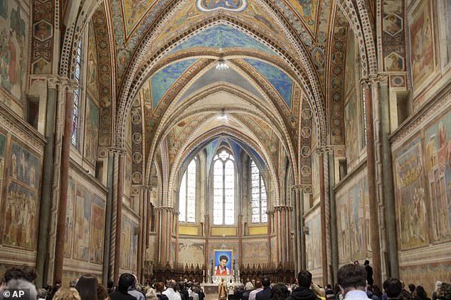 An image of 15-year-old Carlo Acutis is seen during his beatification ceremony celebrated by Cardinal Agostino Vallini at St. Francis Basilica in Assisi, Italy, in October 2020