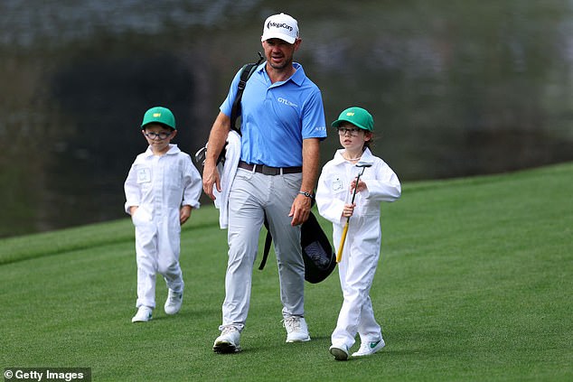 Harman is pictured with son Walter (left) and daughter Cooper (right) at the 2024 Masters