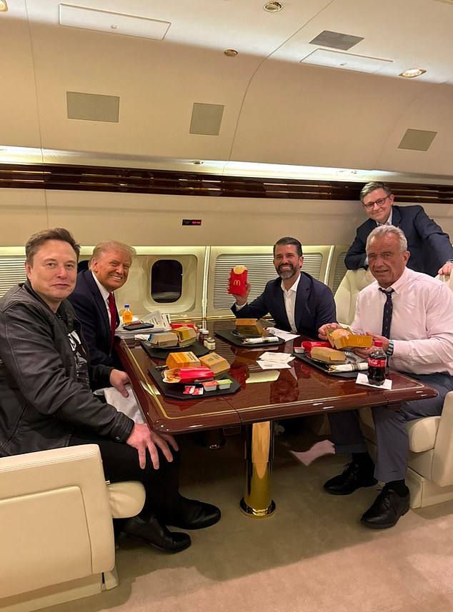 Above, he is seen taking a break from Make America Healthy Again while eating some McDonald's on Trump's plane