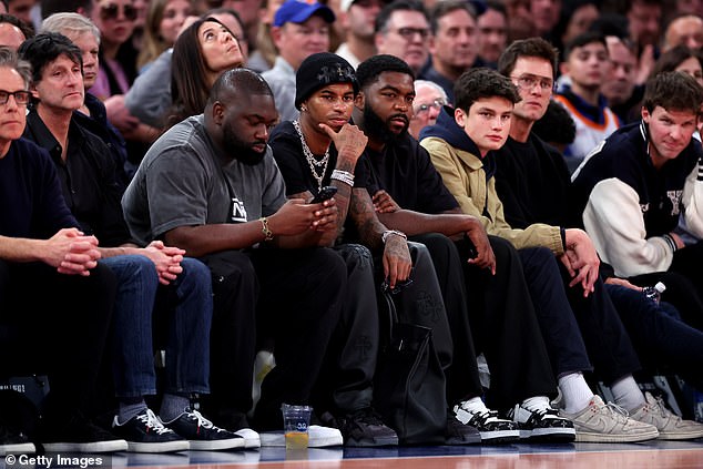 He was flanked on the right by, among others, Hollywood player Ben Stiller and friend Ro-Shaun Williams