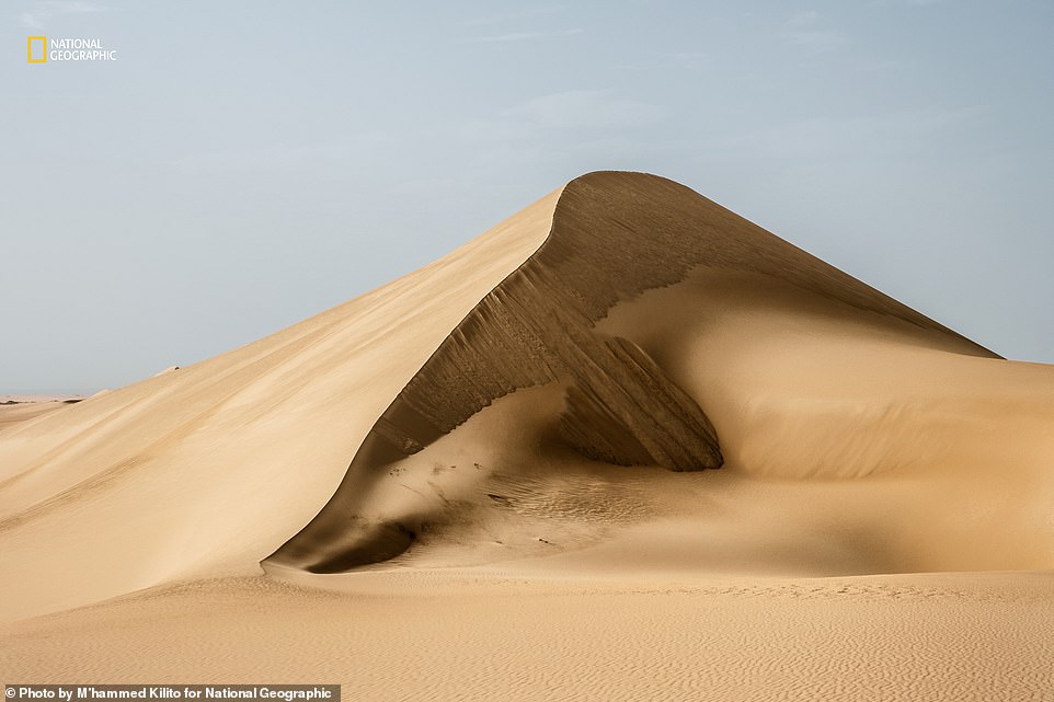 This is the Siwa Oasis in Egypt's Western Desert. The dunes attract many tourists, says Nat Geo