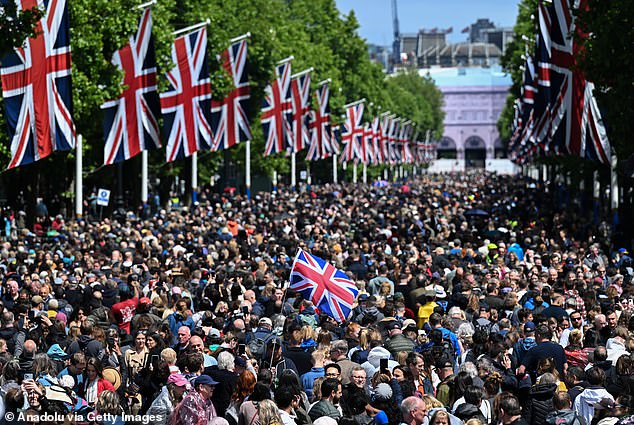 A crowd lines the Mall to celebrate King Charles' birthday during Trooping the Color in June