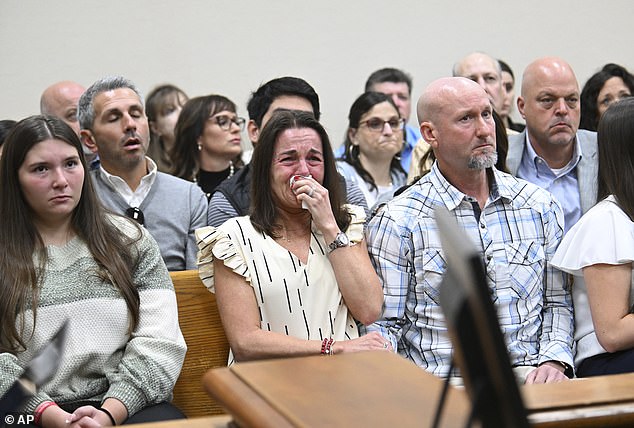 Riley's parents Allyson and John Phillips (center and right) were filled with emotion during the process