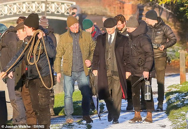 Cast and crew appeared unaffected by freezing temperatures as they filmed a canal scene with Murphy - who reprises his role as criminal kingpin Tommy Shelby