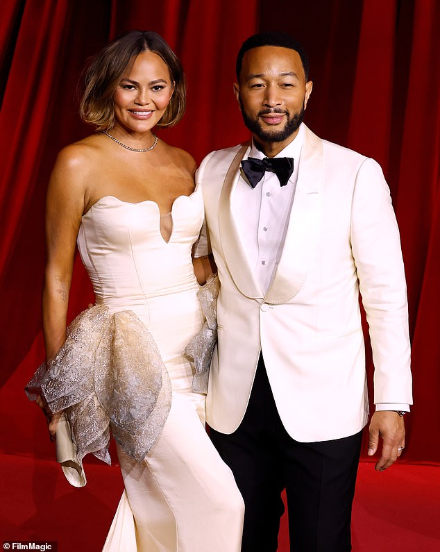 Here the model posed with her husband John Legend; they have four children