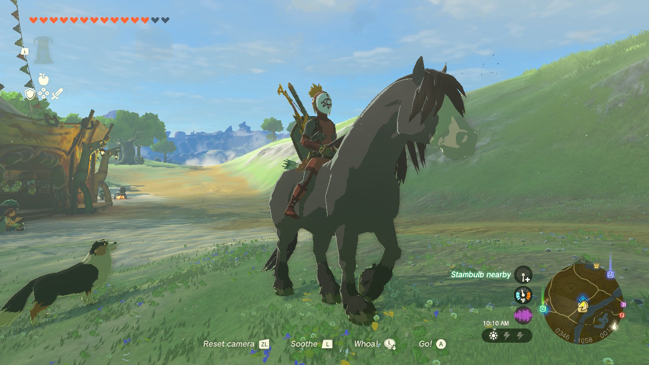 Link rides a black horse through the fields of Hyrule in The Legend of Zelda: Tears of the Kingdom