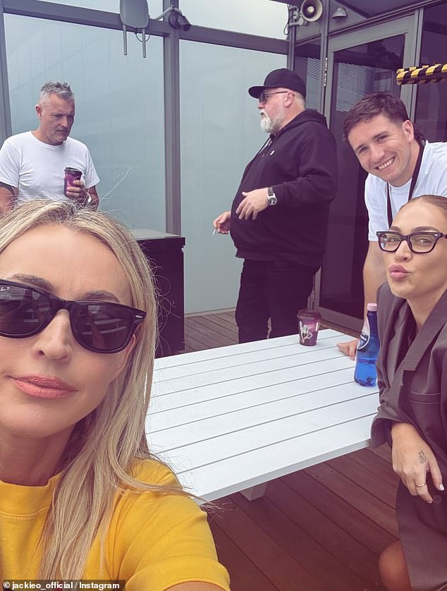 As they relaxed on the roof of their studios, they were joined by Jackie's co-host Kyle Sandilands and two other colleagues, programmer Tony Aldridge and producer Nat Penfold.