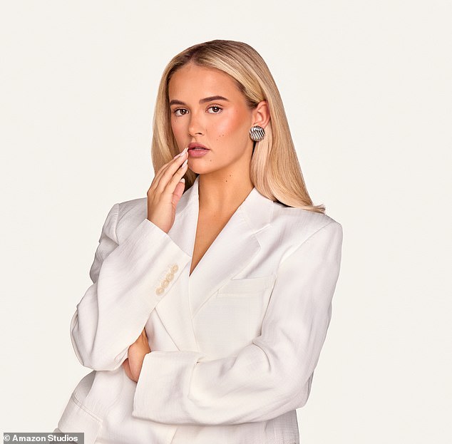 The influencer stuns in new promotional images for the series, wearing a white blazer with gold stud earrings