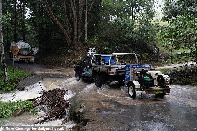 The weather has been so rough that trees have fallen and blocked the road to the campsite and you can see four by four vehicles fighting through the flooded rivers