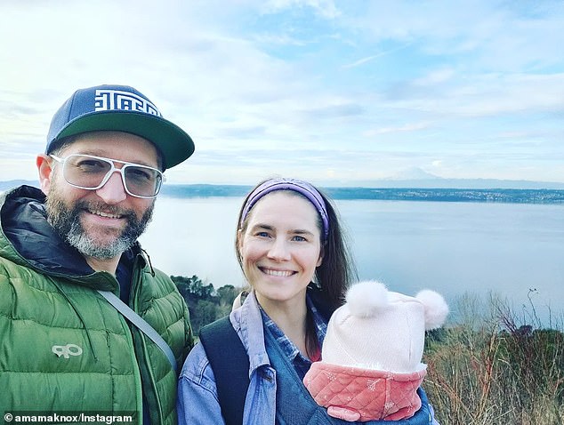 Amanda, daughter Eureka and husband Christopher Robinson on a hike together in 2022