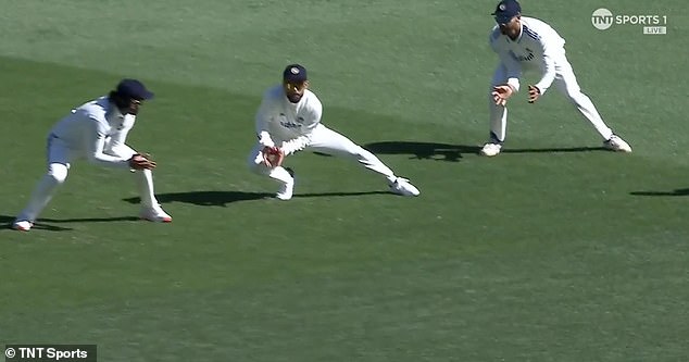 Kohli (centre) appeared to take the catch as his teammates rode away in celebration