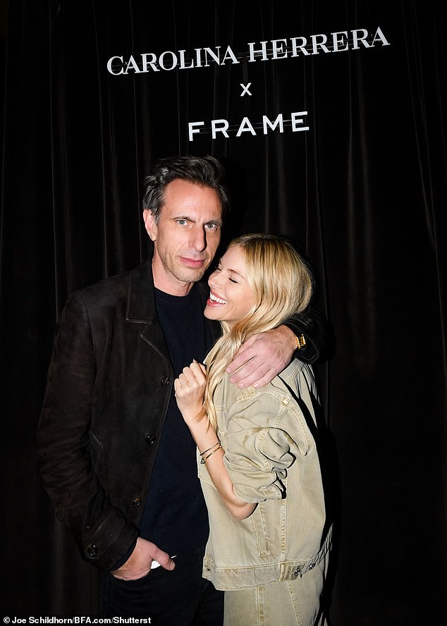 She wore a casual ocher yellow denim combination consisting of an oversized jacket and matching wide leg jeans (pictured with Erik Torstensson)