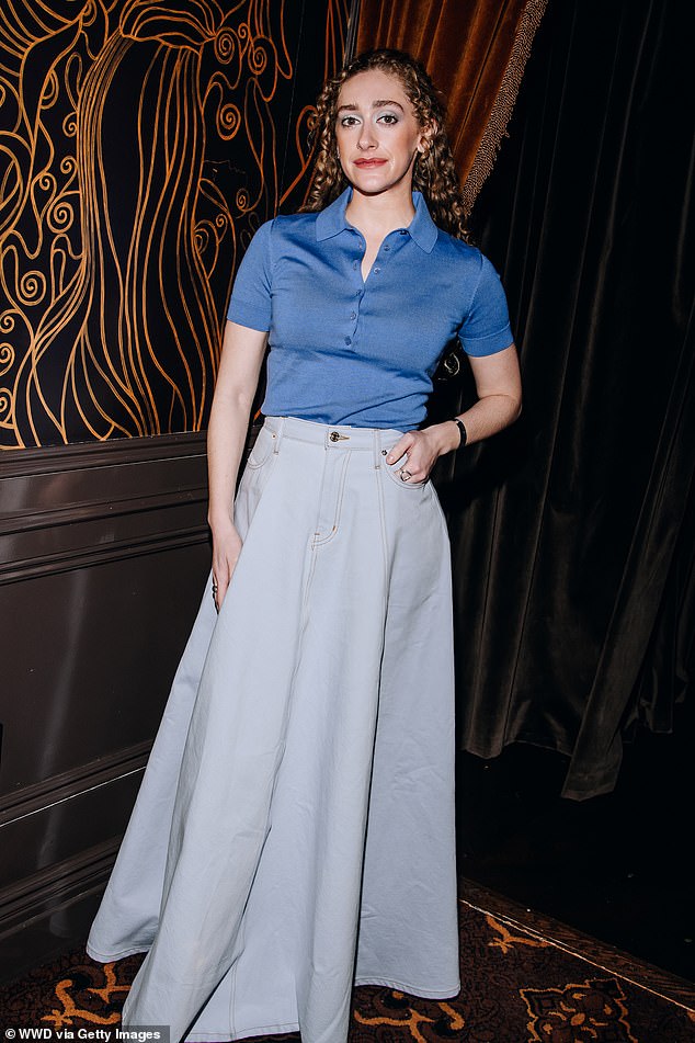 Micaela Diamond wore a blue turtleneck top and an A-line denim skirt