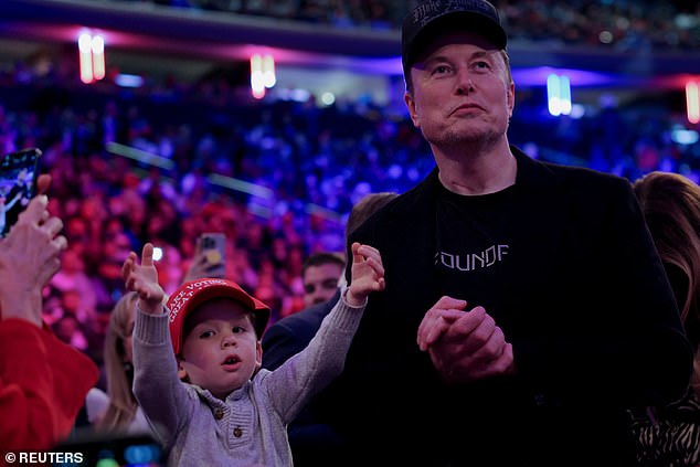 The singer revealed that she has been in a year-long custody battle with the father of their three children. Pictured: Musk and their son at a Trump rally last month