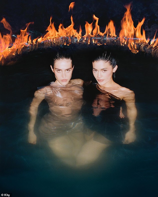 The ladies were also wet in a pool with a ring of fire around them