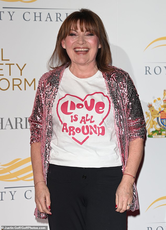 Lorraine Kelly wore a graphic white T-shirt with the words Love Is All Around for Lorraine's campaign