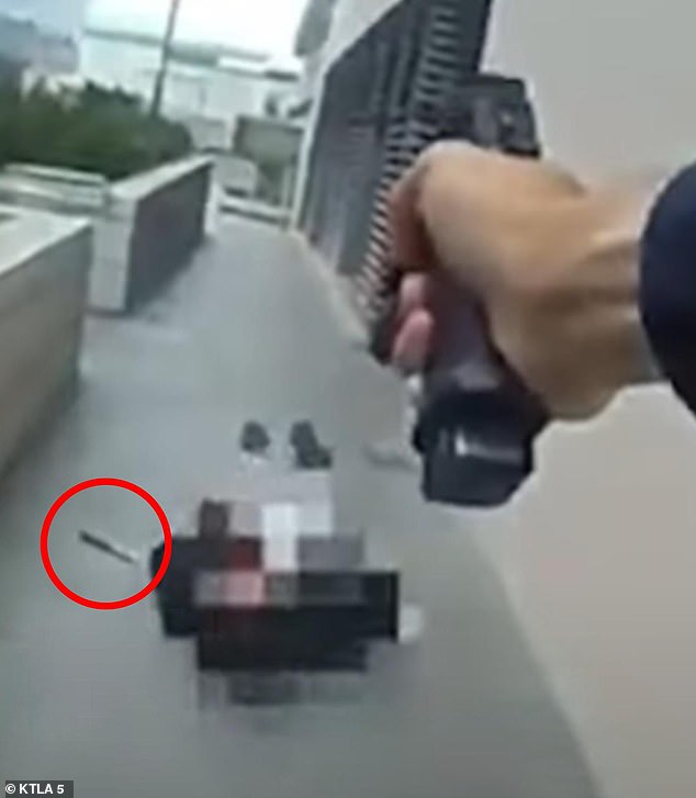 The officer shot and killed the suspect, whose knife can be seen next to his body