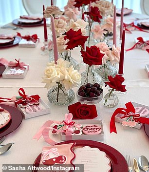 The new mother treated her close friends to a luxurious afternoon tea, with the table decorated with red plates, roses, pink candles and cherries