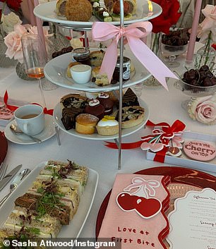 While celebrating Sasha's baby shower, guests enjoyed some sandwiches and sweet treats