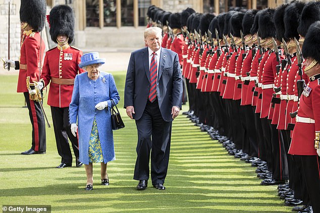 Donald Trump and Britain's Queen Elizabeth II inspect a guard of honor formed by the Coldstream Guards at Windsor Castle on July 13, 2018