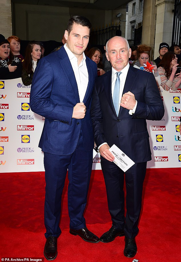 She dated boxing coach Shane in 2018, a year before she found fame on Love Island, when she was working as a ring girl and he was commentating on a match (Shane and Barry pictured in 2014)