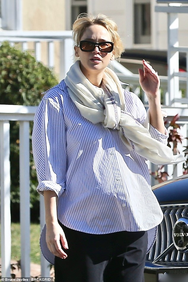 While enjoying a stroll in sunny Los Angeles, the 34-year-old actress looked effortlessly stylish in a pinstripe shirt and black silk trousers.