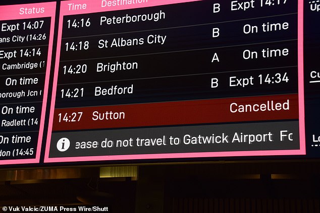 A departures sign in St Pancras yesterday tells travelers not to travel to Gatwick