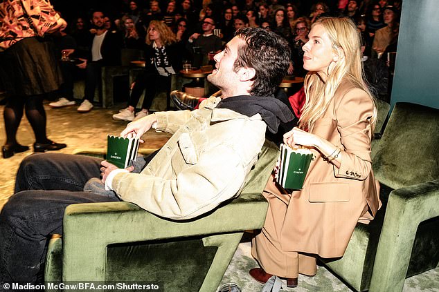 The screening also featured comfy green velvet lounge chairs and Sienna and her boyfriend Oli Green eating some popcorn