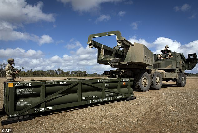 Above, U.S. Army Sergeant and Rifleman Ian Ketterling prepares the crane to load an ATACMS onto a High Mobility Artillery Rocket System (HIMARS) in Queensland, Australia, on July 26, 2023