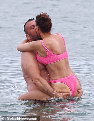 They looked more smitten than ever as Dan picked up Chanelle in the sea and they shared a passionate kiss