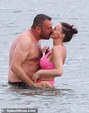 They looked more smitten than ever as Dan picked up Chanelle in the sea and they shared a passionate kiss