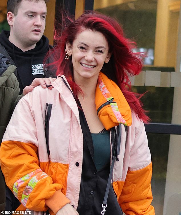 Meanwhile, Strictly pro Dianne cut a vibrant figure in a bright orange and pale pink padded coat