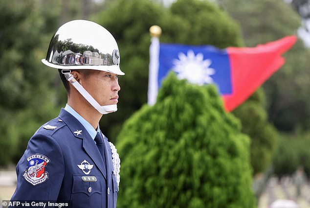 A member of the honor guard is seen during a ceremony commemorating the 75th anniversary of the Battle of Guningtou in Kinmen, Taiwan