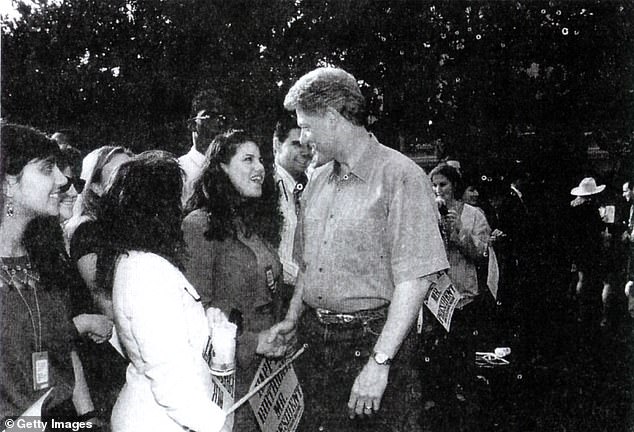 A photo showing former White House intern Monica Lewinsky meeting with President Bill Clinton at a White House function submitted as evidence in documents by the Starr investigation and released by the House Judicary Committee on September 21 1998