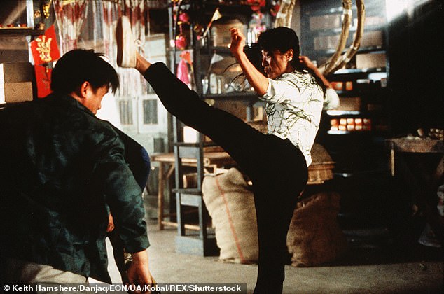 Ms Yeoh (pictured on set) did many of her own stunts on the set of Tomorrow Never Dies