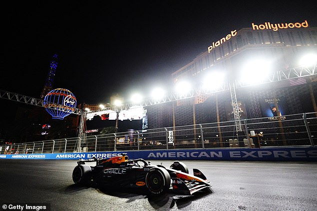 Max Verstappen's Red Bull passes the Planet Hollywood Casino on the Las Vegas Strip