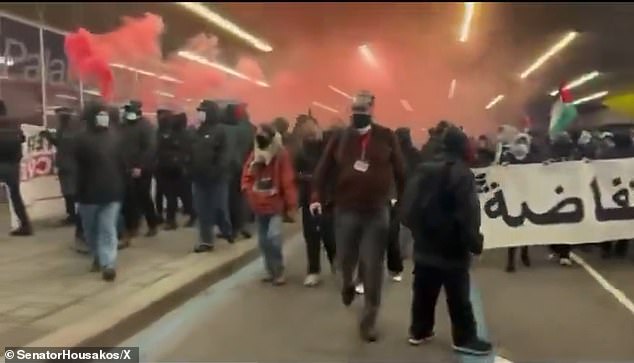 At one point, demonstrators managed to fire red smoke bombs into the crowd.