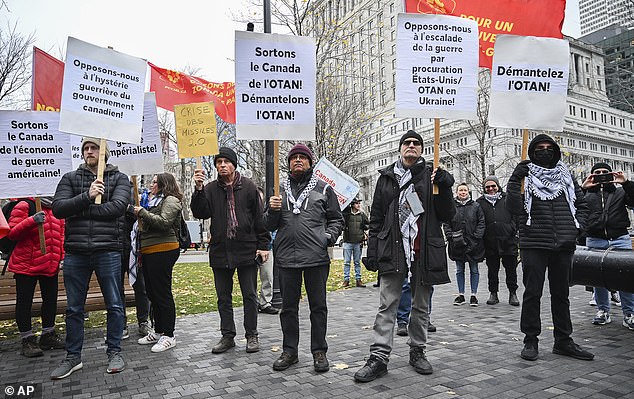 People take part in a protest against NATO in Montreal