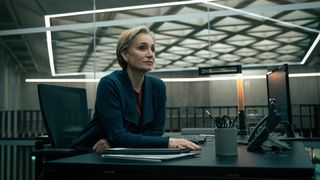 Kristin Scott Thomas sits at her desk in Slow Horses