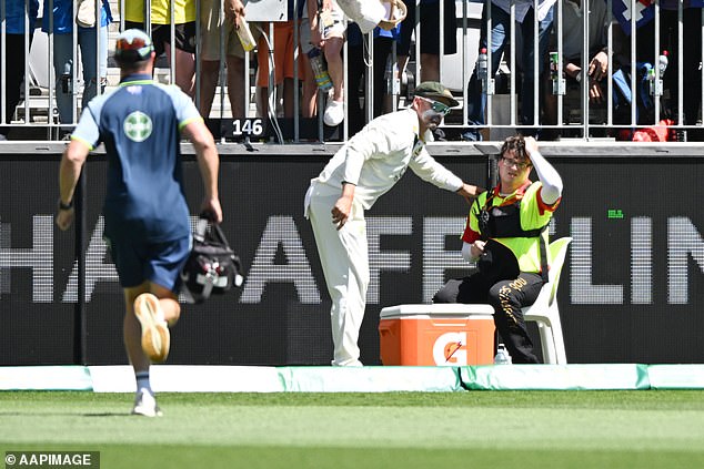 Concerns immediately arose among the players, with Nathan McSweeney and Nathan Lyon (second from left) rushing to the boundary to check on young Stewart.