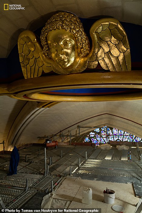 “At the top of the vaulted ceiling, a gilded angel adorns the oculus, a stone ring,” explains Nat Geo. 'During the fire, massive damage was caused when the falling spire pierced the ceiling. From the scaffolding shown here, workers closed off the massive opening and rebuilt the oculus'