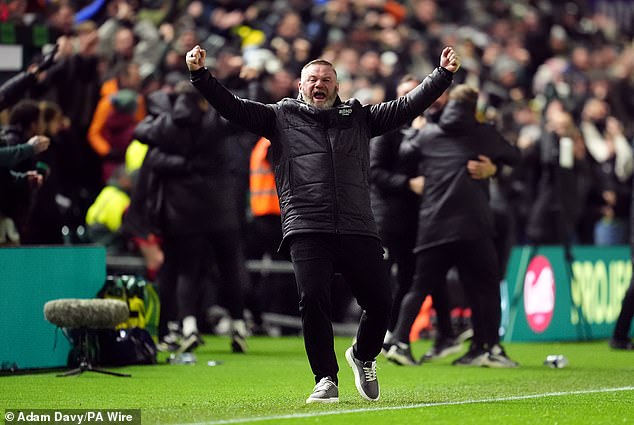 Plymouth Argyle manager Wayne Rooney celebrates the equalizer to make it 2-2. During the match, fans directed misogynistic chants about his wife at him