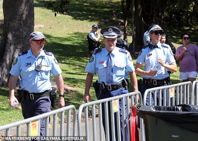 Police patrolled the harborside walkways in Mrs Macquaries Point on the edge of the gardens