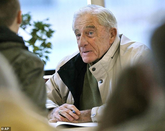 Donn Fendler talks to a young reader at a book signing in Bangor, Maine, in 2011. He treated hundreds of schoolchildren to his adventure story over the decades